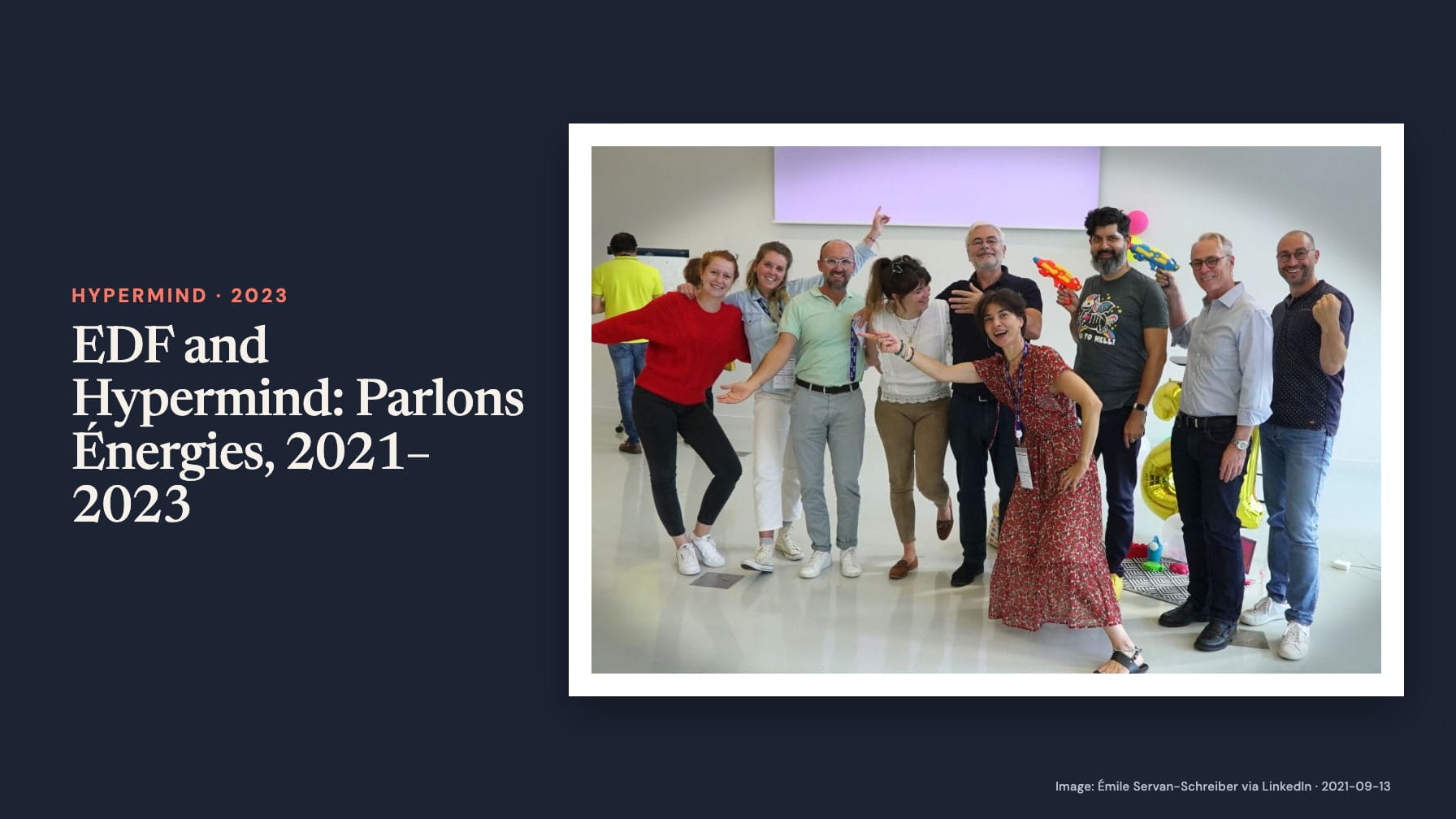Navy cover headed “EDF and Hypermind: Parlons Énergies, 2021–2023” beside a group photo of smiling adults posing with balloons and colorful toy water pistols.