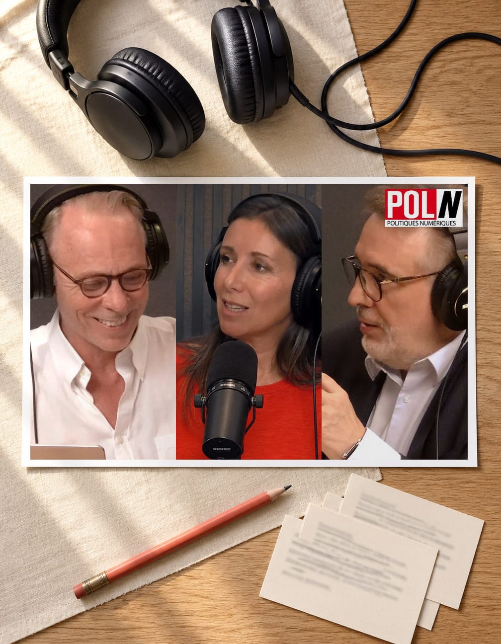 Editorial illustration of a printed three-panel still from the POL/N episode, showing Émile Servan-Schreiber, Delphine Sabattier and Bernard Benhamou at studio microphones, laid on linen beneath a pair of headphones.